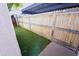 Fenced back yard with artificial turf provides a private outdoor living space at 5458 W El Caminito Dr, Glendale, AZ 85302
