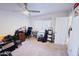 Spacious bedroom with neutral carpet features a large window and ample closet space at 5458 W El Caminito Dr, Glendale, AZ 85302
