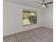 Bedroom with neutral carpet, a ceiling fan, and a sliding window at 5458 W El Caminito Dr, Glendale, AZ 85302