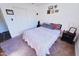 Bright bedroom features carpet floors and a large closet for storage at 5458 W El Caminito Dr, Glendale, AZ 85302