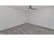 Neutral carpeted bedroom featuring a ceiling fan at 5458 W El Caminito Dr, Glendale, AZ 85302