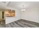 Open dining space with hardwood floors and adjacent kitchen area at 5458 W El Caminito Dr, Glendale, AZ 85302