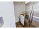 Efficient laundry area featuring modern appliances near a refrigerator at 5458 W El Caminito Dr, Glendale, AZ 85302