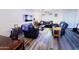 Bright living room with ceiling fan, modern flooring, and comfortable seating arrangement at 5458 W El Caminito Dr, Glendale, AZ 85302