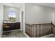 Upstairs hallway with wood railing, window desk overlooking the beautiful landscape at 5519 W Molly Ln, Phoenix, AZ 85083