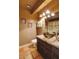 Cozy bathroom with unique bowl sink, granite counters, framed art, and ceramic tile floors at 5824 N Scottsdale Rd, Paradise Valley, AZ 85253