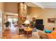 Spacious living room with a stunning stone fireplace, tile floors, and an open layout to the kitchen at 5824 N Scottsdale Rd, Paradise Valley, AZ 85253