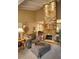 Cozy living space with a statement stone fireplace, neutral decor, and bright, airy atmosphere at 5824 N Scottsdale Rd, Paradise Valley, AZ 85253
