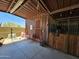 View of horse stall with horse inside, sitting area outside, and wooden construction at 6347 E Old West Way, Cave Creek, AZ 85331