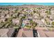 Aerial view of residential neighborhood with desert landscaping, tile roofs, and a community with mountain views at 6931 W Antelope Dr, Peoria, AZ 85383
