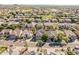 Wide aerial view of a suburban neighborhood featuring desert landscaping and mountain views in the distance at 6931 W Antelope Dr, Peoria, AZ 85383