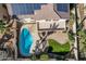 Gorgeous aerial shot of a property with a private pool, covered patio, and lush green spaces at 6931 W Antelope Dr, Peoria, AZ 85383
