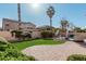 Private backyard with a lush lawn, brick patio, and a glimpse of the inviting pool, perfect for outdoor enjoyment at 6931 W Antelope Dr, Peoria, AZ 85383