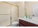 Bathroom featuring vanity sink, toilet, and shower with sliding glass door and neutral-colored walls at 6931 W Antelope Dr, Peoria, AZ 85383