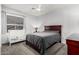 Well-lit bedroom with a ceiling fan, a large window and space for a crib at 6931 W Antelope Dr, Peoria, AZ 85383