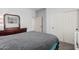 Neutral bedroom featuring a dresser, mirror and a double door closet at 6931 W Antelope Dr, Peoria, AZ 85383
