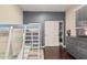 ' bedroom with a modern loft bed, wooden floors, and a gray accent wall at 6931 W Antelope Dr, Peoria, AZ 85383