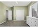 Light green bedroom featuring a large window and closet at 6931 W Antelope Dr, Peoria, AZ 85383