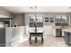 Bright dining area featuring modern lighting, neutral walls, and seamless access to the adjacent kitchen at 6931 W Antelope Dr, Peoria, AZ 85383