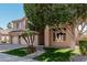 Charming two-story home with a three car garage, desert landscaping, and tiled roof details at 6931 W Antelope Dr, Peoria, AZ 85383
