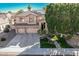 Stately home with a manicured lawn, three-car garage, tiled roof, and a welcoming entrance at 6931 W Antelope Dr, Peoria, AZ 85383