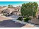 Charming home featuring a well-maintained lawn, paved walkway, three-car garage, and mature landscaping at 6931 W Antelope Dr, Peoria, AZ 85383