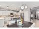 Eat-in kitchen featuring a large center island, modern stainless steel appliances, and lots of sunlight at 6931 W Antelope Dr, Peoria, AZ 85383