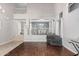 Bright living room with hardwood floors, and view into the dining area and entry at 6931 W Antelope Dr, Peoria, AZ 85383