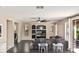 Spacious living room with built-in media center and sliding glass doors to backyard at 6931 W Antelope Dr, Peoria, AZ 85383