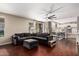 Expansive living room with a large sectional couch and view of the backyard at 6931 W Antelope Dr, Peoria, AZ 85383