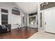 Bright entryway featuring hardwood floors, high ceilings, a stylish chandelier, and natural light at 6931 W Antelope Dr, Peoria, AZ 85383