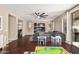 Living room featuring ceiling fan and sliding glass doors to the backyard at 6931 W Antelope Dr, Peoria, AZ 85383