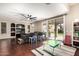 Open living room featuring a ceiling fan, and sliding glass doors to the backyard at 6931 W Antelope Dr, Peoria, AZ 85383