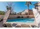 Comfortable lounge chairs by the pool with sun umbrellas create a relaxing poolside retreat at 6931 W Antelope Dr, Peoria, AZ 85383