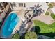 Aerial view of a backyard featuring a private pool, patio, and well-manicured lawn area at 6931 W Antelope Dr, Peoria, AZ 85383