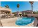 Inviting private pool area with lounge chairs and tropical palm trees, perfect for relaxing and entertaining at 6931 W Antelope Dr, Peoria, AZ 85383