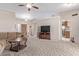 Bright living room with neutral walls, carpet, and views of the front door and kitchen, offering open-concept living at 7454 E Pueblo Ave, Mesa, AZ 85208