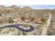 Stunning street view of desert homes featuring tile roofs and attached garages at 7546 E Camino Puesta Del Sol --, Scottsdale, AZ 85266