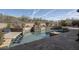 Beautiful swimming pool with stone decking, elegant water features, and lush desert landscaping at 7546 E Camino Puesta Del Sol --, Scottsdale, AZ 85266