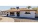 Close-up of a charming home with a well-designed brick walkway and inviting entryway at 821 W Missouri Ave, Phoenix, AZ 85013