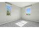 A well-lit bedroom with dual windows offers a bright and airy feel at 8516 W Peppertree Ln, Glendale, AZ 85305