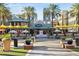 Outdoor venue featuring lush landscaping, potted plants, covered seating, and outdoor dining areas for gathering and relaxation at 8516 W Peppertree Ln, Glendale, AZ 85305