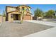 Charming home exterior showcasing a well-maintained front yard and a paved driveway at 8516 W Peppertree Ln, Glendale, AZ 85305