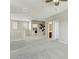 Upstairs landing with a ceiling fan, bathroom, laundry, and bedroom access at 8516 W Peppertree Ln, Glendale, AZ 85305