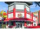 Classic Johnny Rockets restaurant with retro design, red and white facade, and vintage-inspired signage at 8516 W Peppertree Ln, Glendale, AZ 85305