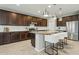 Kitchen with island and seating, stainless appliances, granite countertops and tile backsplash at 8516 W Peppertree Ln, Glendale, AZ 85305