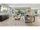 Bright living room featuring a large window, stylish decor, and seamless flow to the outdoor living space at 8516 W Peppertree Ln, Glendale, AZ 85305