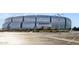 Exterior view of the modern State Farm Stadium, along with partial views of the parking area at 8516 W Peppertree Ln, Glendale, AZ 85305