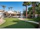 Expansive backyard with pool, putting green, lounge area, and mature landscaping at 9128 N 70Th St, Paradise Valley, AZ 85253