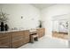 Bathroom featuring dual sinks with marble countertop vanities and mosaic tile flooring at 9128 N 70Th St, Paradise Valley, AZ 85253